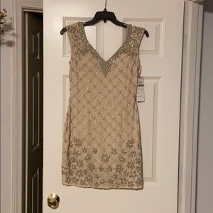 Aria couture short beaded Champaign dress. Nwt